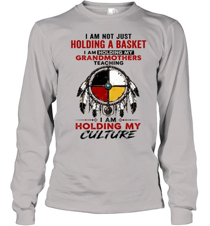 I AM NOT JUST HOLDING A BASKET I AM HOLDING MY GRANDMOTHERS TEACHING I AM HOLDING MY CULTURE