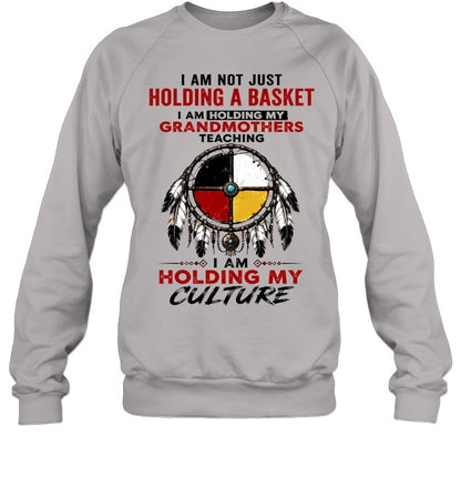 I AM NOT JUST HOLDING A BASKET I AM HOLDING MY GRANDMOTHERS TEACHING I AM HOLDING MY CULTURE