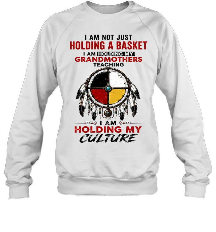 I AM NOT JUST HOLDING A BASKET I AM HOLDING MY GRANDMOTHERS TEACHING I AM HOLDING MY CULTURE